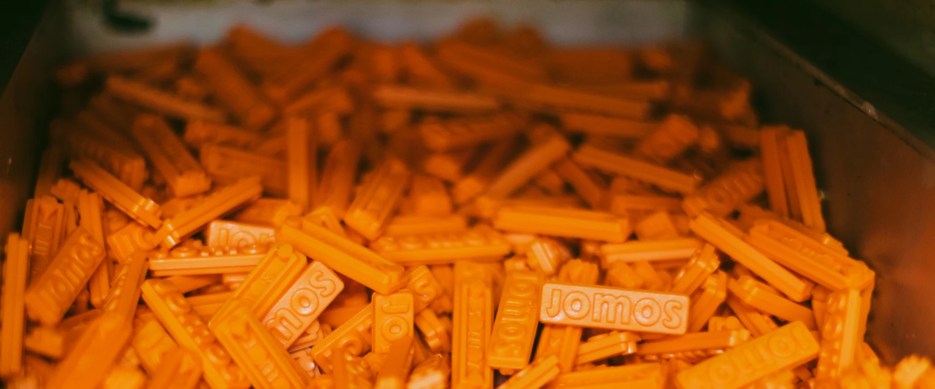 Jomos Badge in orange
